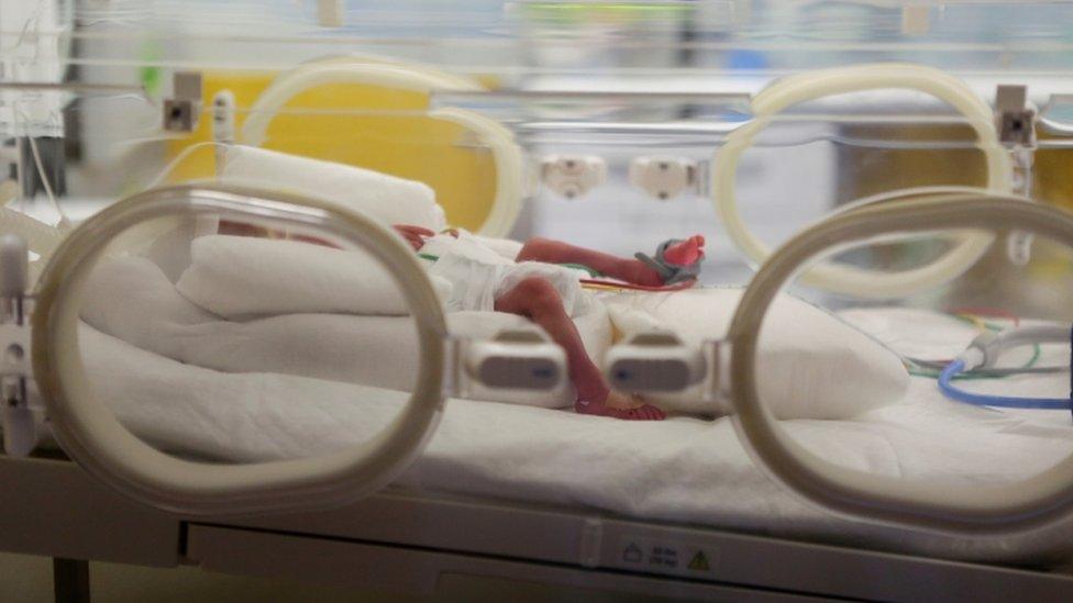 One of the nonuplets is seen in an incubator at the private clinic of Ain Borja, in Casablanca, Morocco May 5, 2021