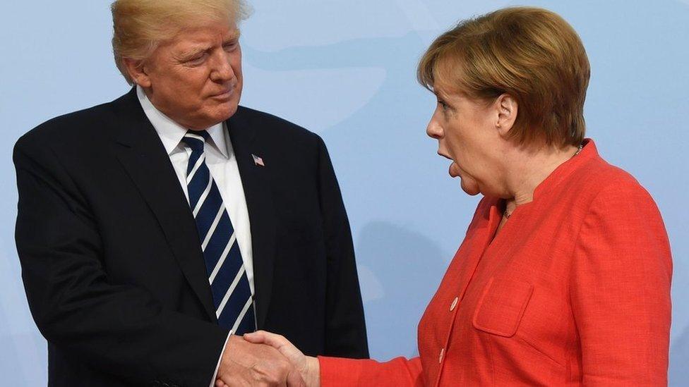 German Chancellor Angela Merkel greets US President Donald Trump in Hamburg, 7 July