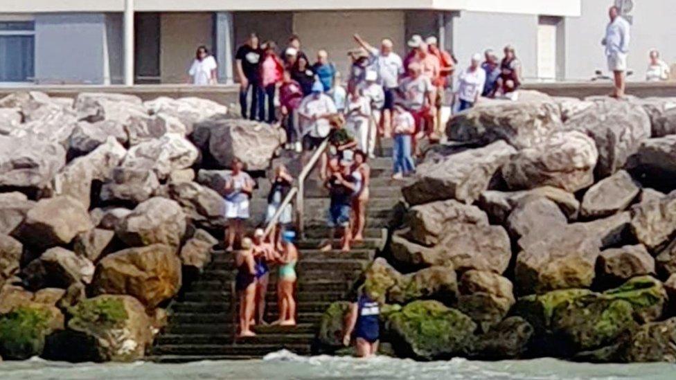 The three women landing in France to a welcoming crowd.