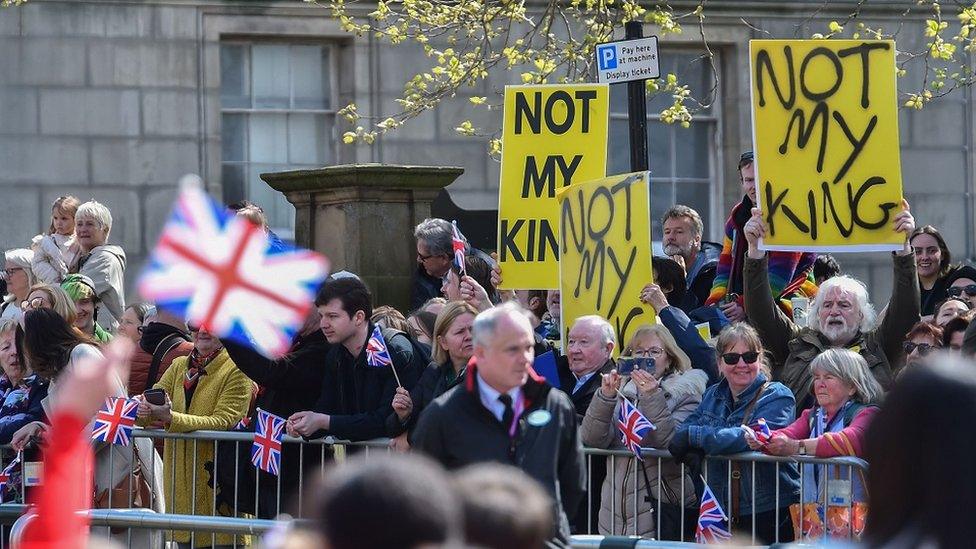 Anti-monarchy protesters hold placards during the visit by Britain's King Charles III and Camilla Queen Consort to Liverpool Central Library, in Liverpool