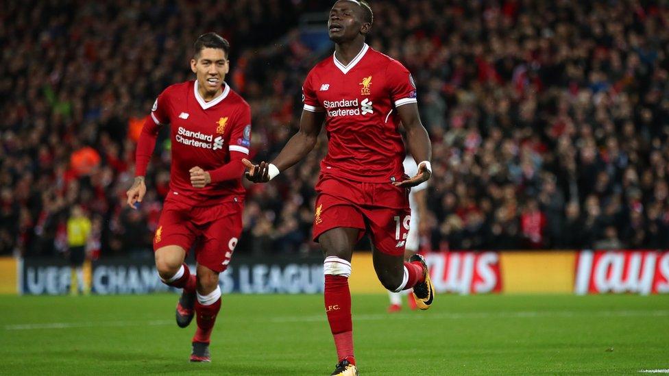 Sadio Mane of Liverpool celebrates after scoring his side's fourth goal with Roberto Firmino of Liverpool during the UEFA Champions League group E match between Liverpool FC and Spartak Moscow at Anfield on December 6, 2017 in Liverpool, United Kingdom.