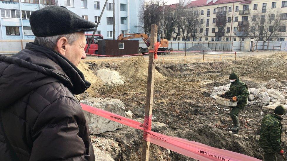 Mikhail looks out over the site of the mass grave in Brest's old wartime ghetto