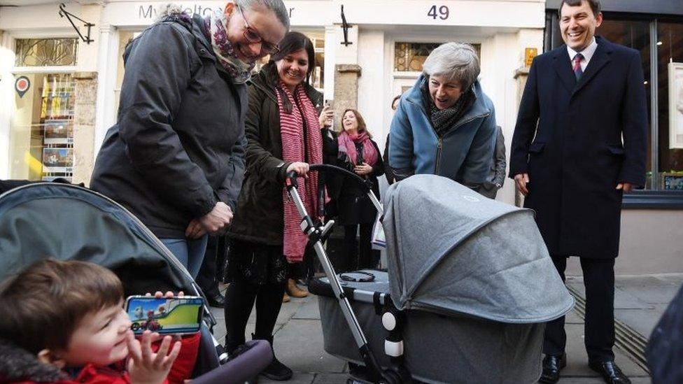 Therese May meets children and parents