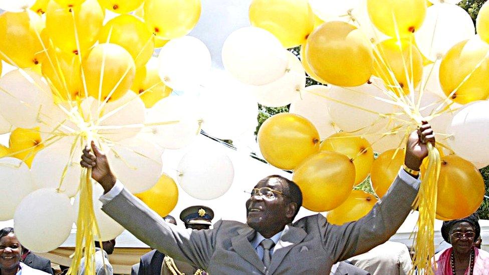 Zimbabwe's veteran leader Robert Mugabe holds 83 balloons in front of relatives and friends at his official residence in Harare, Zimbabwe - 21 February 2007