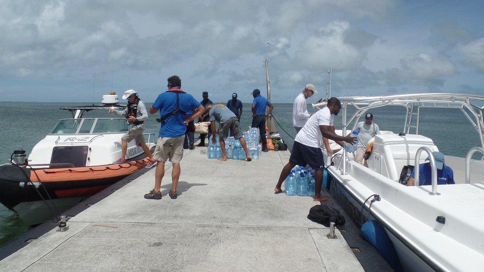 Unloading emergency supplies at Barbuda dock