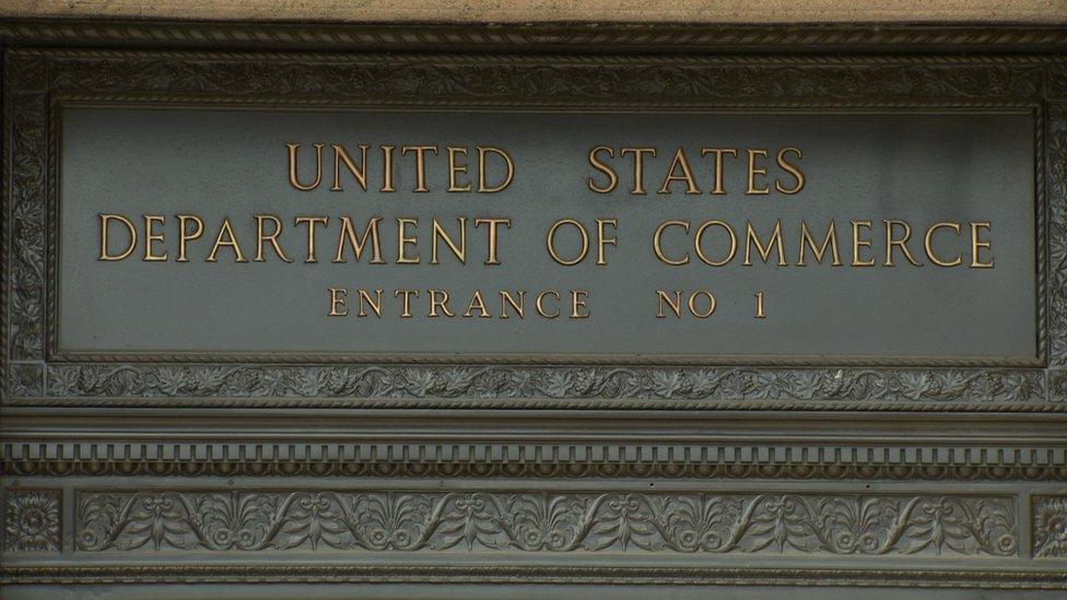 Logo outside the American Department of Commerce entrance