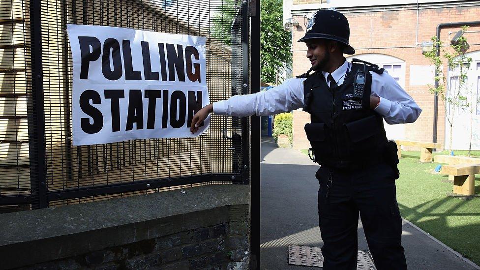 A policeman at a polling station