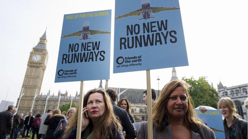 Protesters against a proposed expansion of Heathrow Airport gather at a rally in Parliament Square in London, 10 Oct 2015