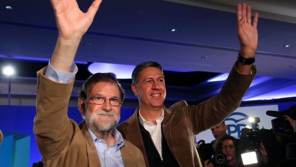 Spanish Prime Minister Mariano Rajoy and Catalan People's Party (PP) President Xavier Garcia Albiol wave as they arrive at a Catalan regional People's Party meeting in Barcelona, Spain 12 November 2017