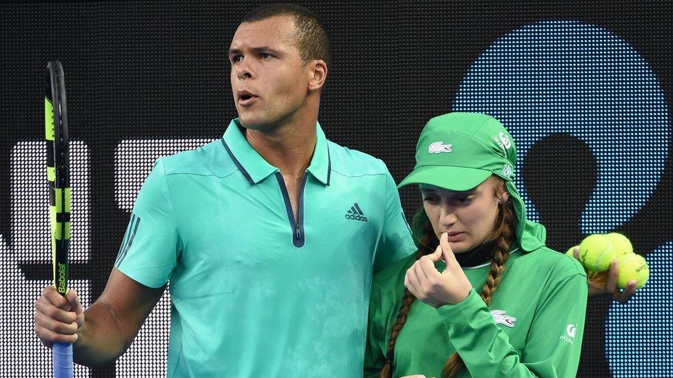 Jo-Wilfried Tsonga escorts the ball girl off court at last year's Australian Open