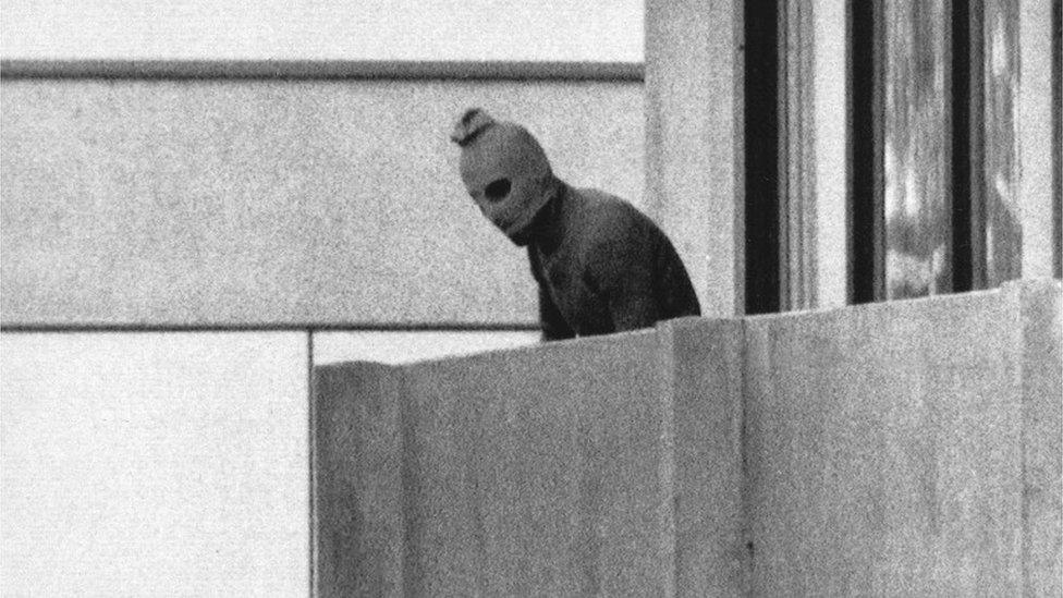 Hooded Palestinian militant on balcony at Olympic Village at Munich Olympics, 1972