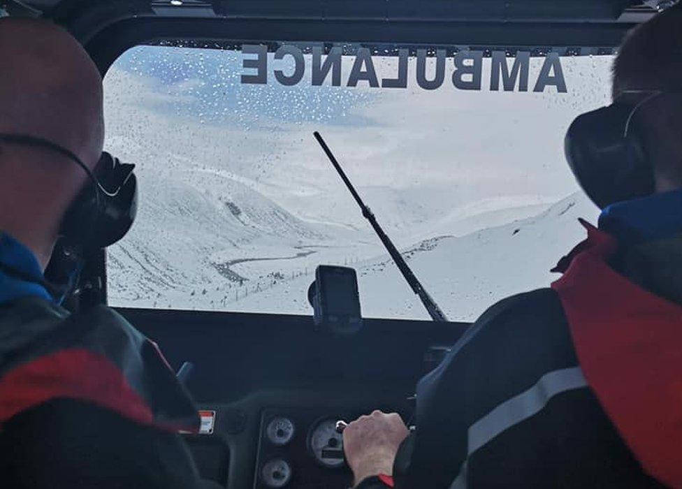 Braemar MRT members headed for the bothy in an off-road ambulance