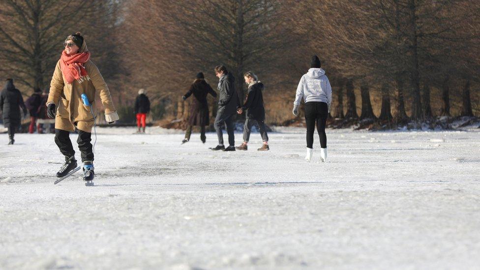 People ice skate during a cold wave across the country, in Amsterdam, Netherlands February 12, 2021.