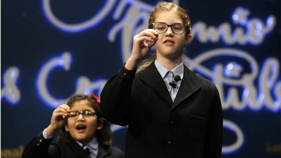 School children sing out the number of the top prize of Spain's Christmas lottery known as "El Gordo"