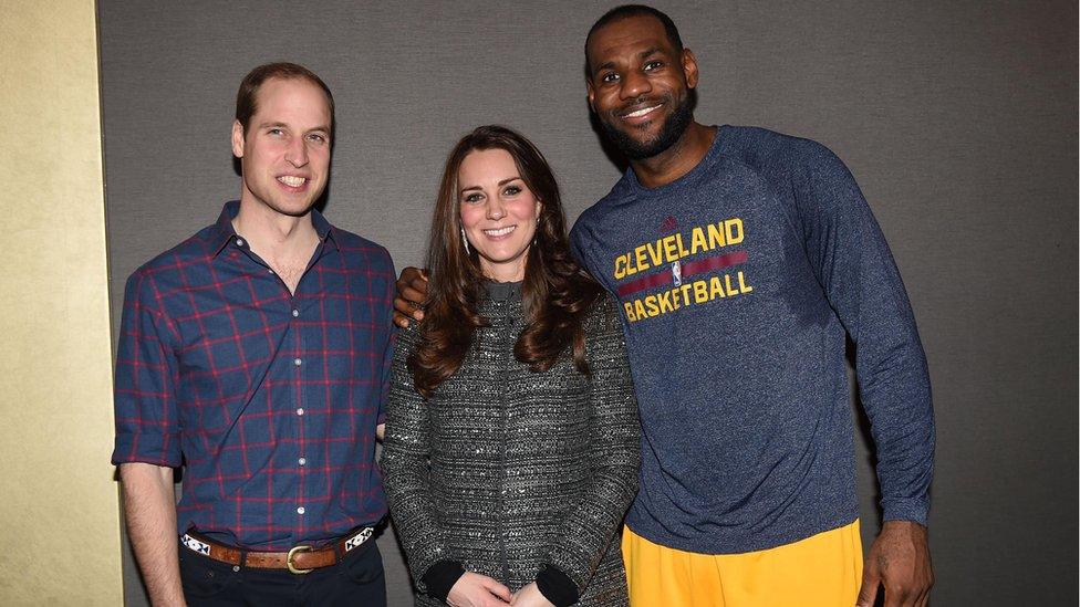 Prince William, Duke of Cambridge and Catherine, Duchess of Cambridge pose with basketball player LeBron James