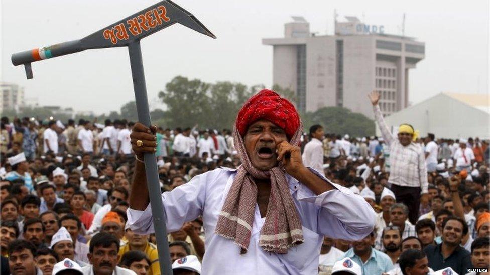 A member of the Patel community holding a mock scratch plough shouts slogans during a protest rally in Ahmedabad, India, August 25, 2015.