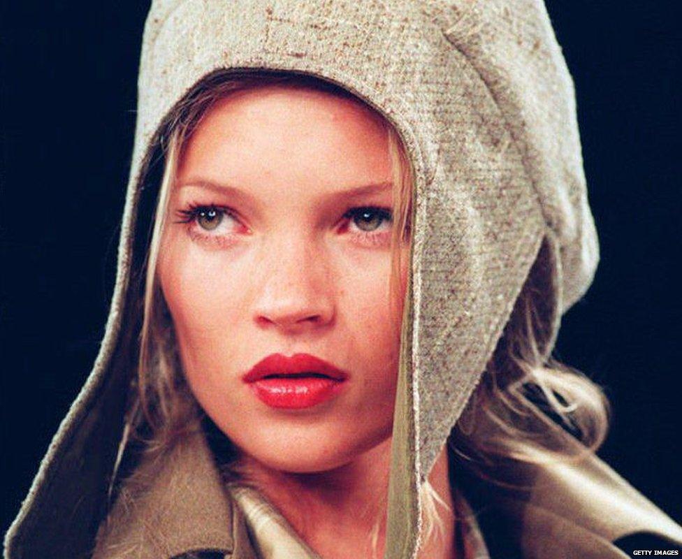 Kate Moss modelling a flapped hat in 1994