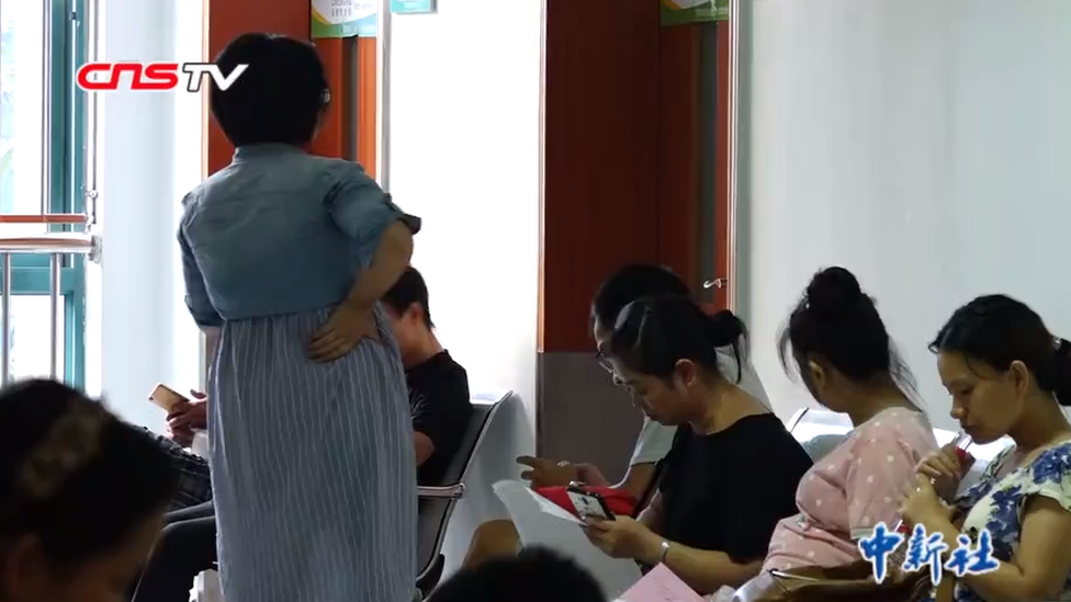 Pregnant women in a hospital waiting room in Wuhan