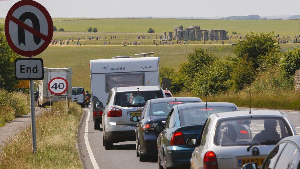 Traffic queuing past Stonehenge