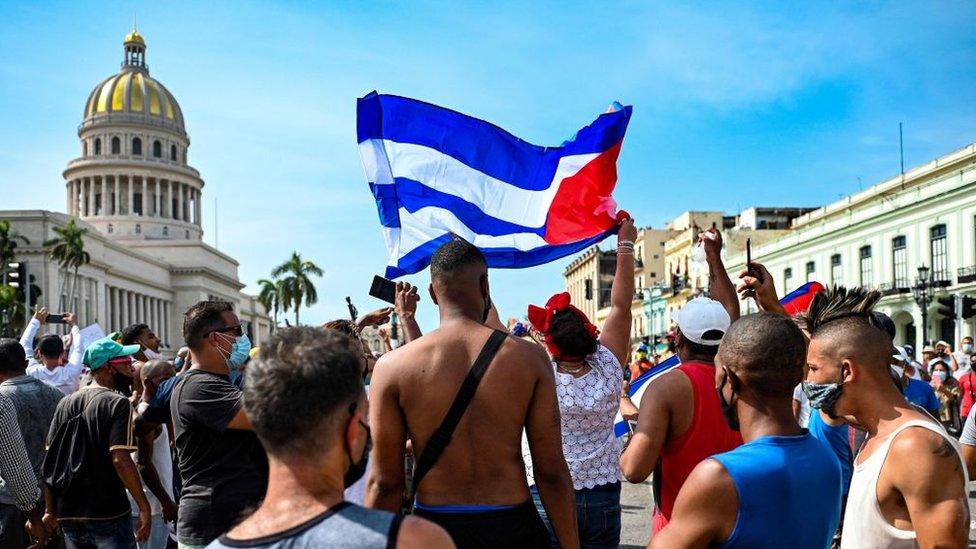 Cubans are seen outside Havana's Capitol during a demonstration against the government of Cuban President Miguel Diaz-Canel in Havana, on July 11, 2021