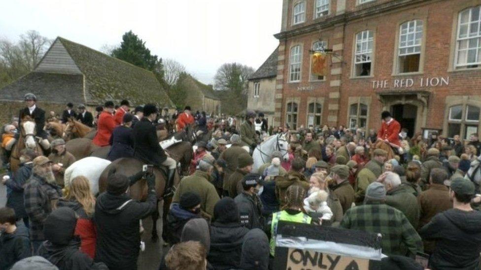 Crowd outside a pub in Lacock for the Avon Vale hunt meet