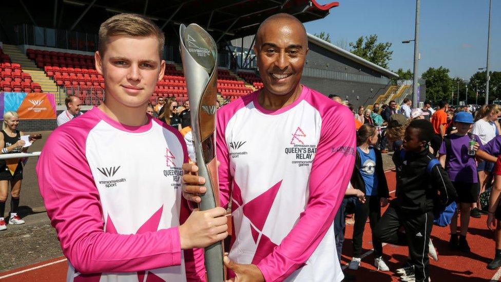 Baton bearers Ryan Donnelly and Colin Jackson CBE hold the Queen's Baton during the Birmingham 2022 Queen's Baton Relay on a visit to Basildon Sporting Village