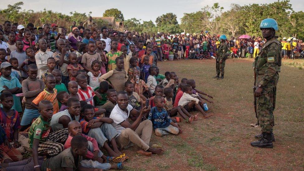 Under the careful gaze of UN peacekeepers, residents of Damara gather for the first Nouvelles Écritures concert of the Poupou Siriri tour