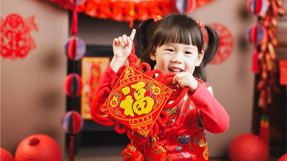 Girl with decorated bag.