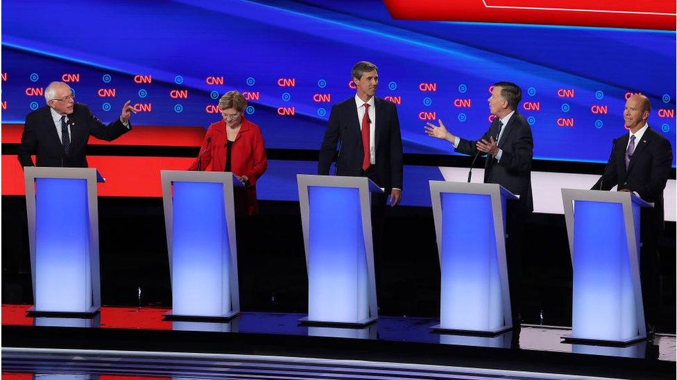 Democratic presidential candidate Sen. Bernie Sanders (I-VT) (L) and former Colorado governor John Hickenlooper (2nd R) speaks while Sen. Elizabeth Warren (D-MA) (2nd L), former Texas congressman Beto O'Rourke and former Maryland congressman John Delaney during the Democratic Presidential Debate