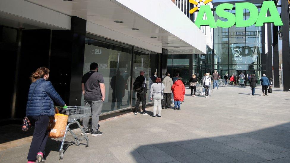 Queue outside an Asda store