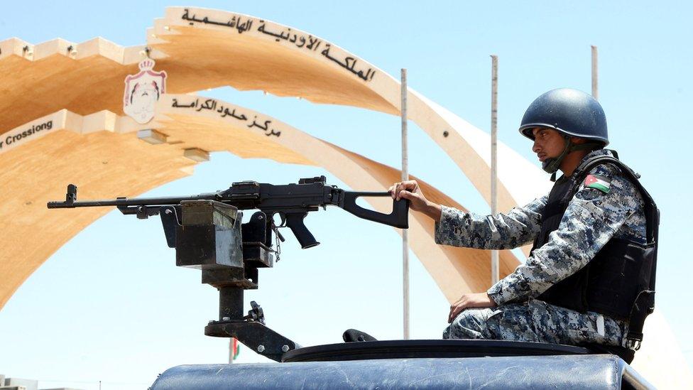 Jordanian soldier sits on an armoured personnel carrier near the Jordan-Iraq border (25 June 2014)