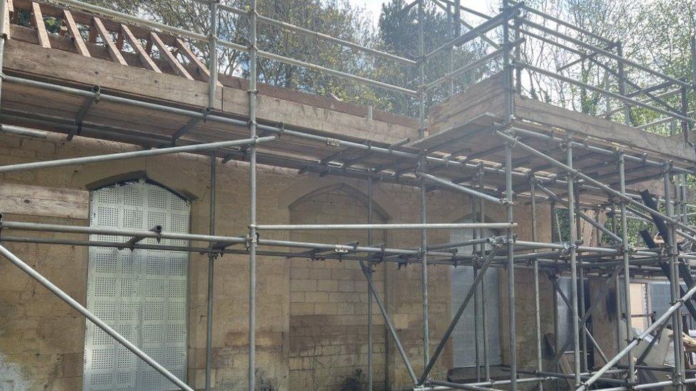 Scaffolding surrounds the station