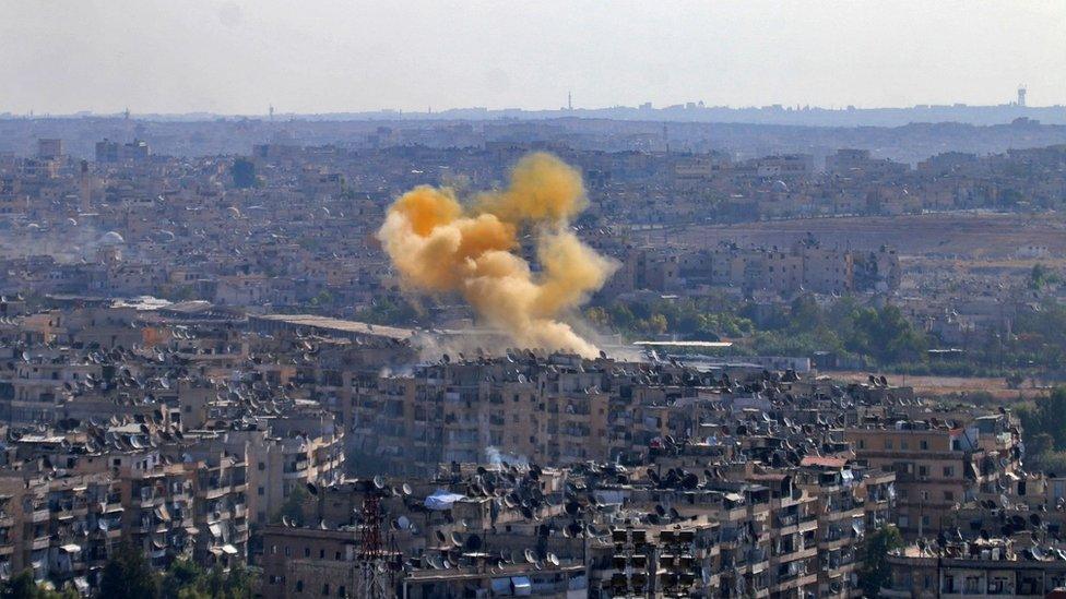 Smoke rises from reported opposition fire from buildings in an eastern government-held neighbourhood of the northern Syrian city of Aleppo on October 20, 2016