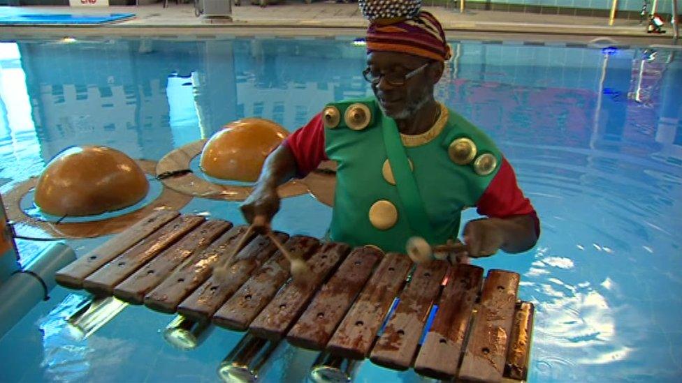 A man plays a floating xylophone