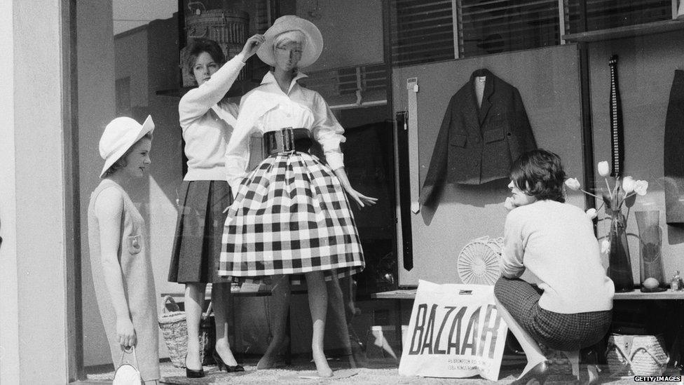 Women dressing a shop window in 1959