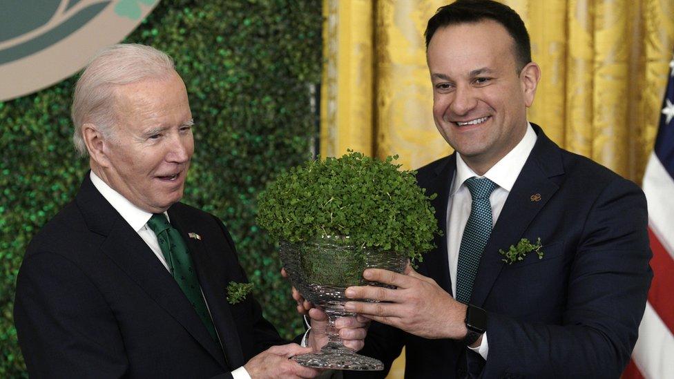 Joe Biden and Leo Varadkar exchange a bowl of shamrock