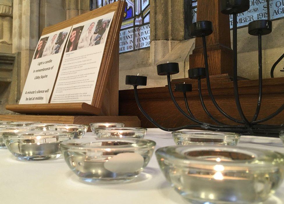 Candles underneath a Libby Squire memorial plaque