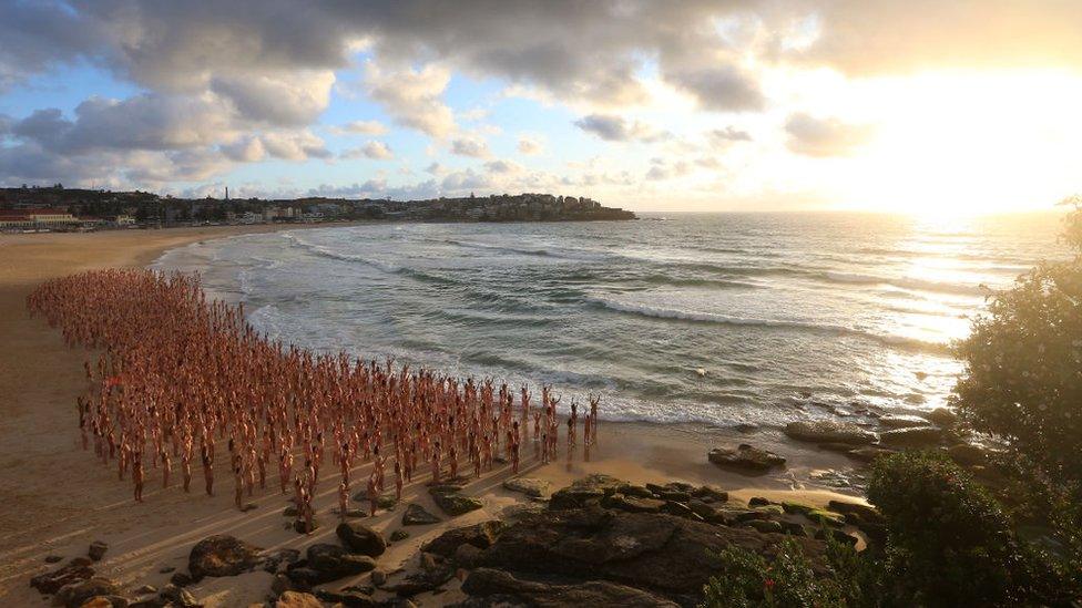 People pose naked on Bondi Beach, Australia