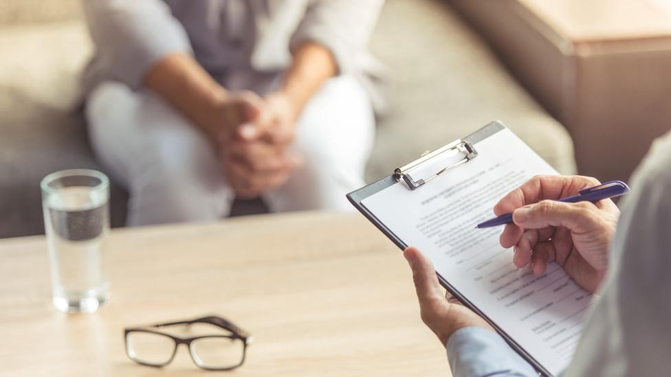 Doctor talks to patient