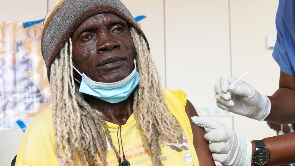 A member of hospital staff receives a vaccine for Covid-19 at Juba Teaching Hospital, on April 7, 2021 in Juba, South Sudan