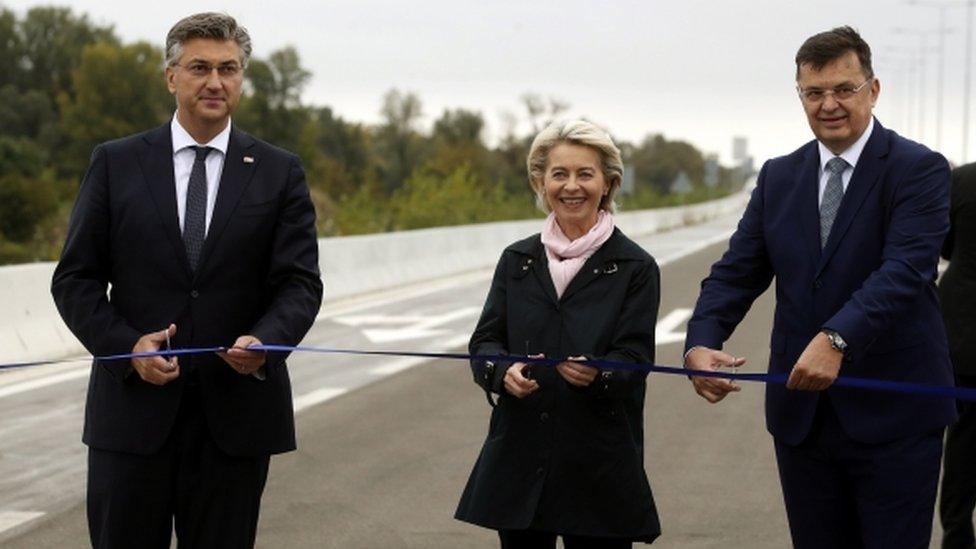 Ursula von der Leyen (C), Croatian Prime Minister Andrej Plenkovic (L) and Chairman of the Council of Ministers of Bosnia and Herzegovina, Zoran Tegletija (R) open a border crossing, a bridge over the Sava River between Croatia and Bosnia and Herzegovina