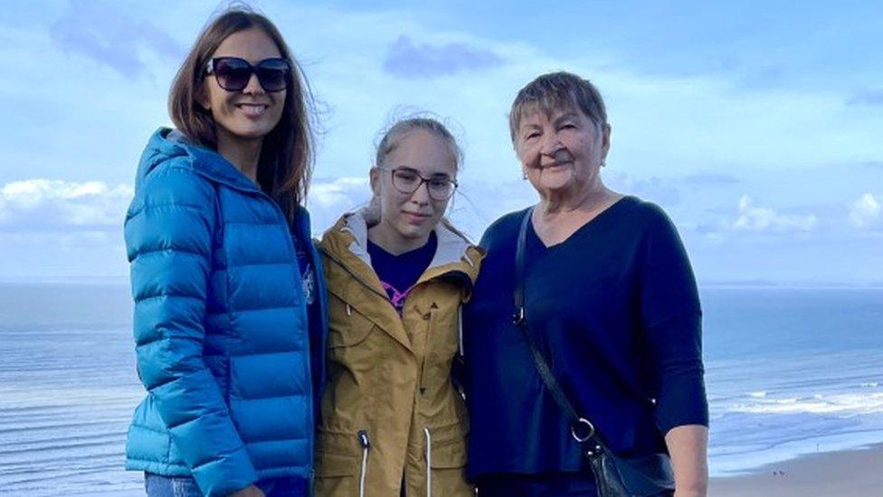 The family standing above a welsh beach