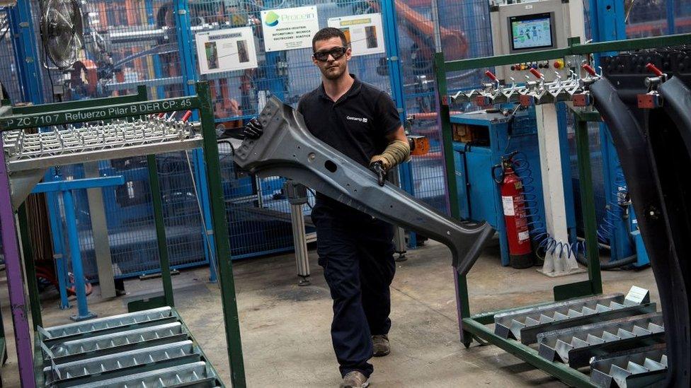 An operator works on processed metal at the Gestamp Automocion factory branch in Abrera, near Barcelona