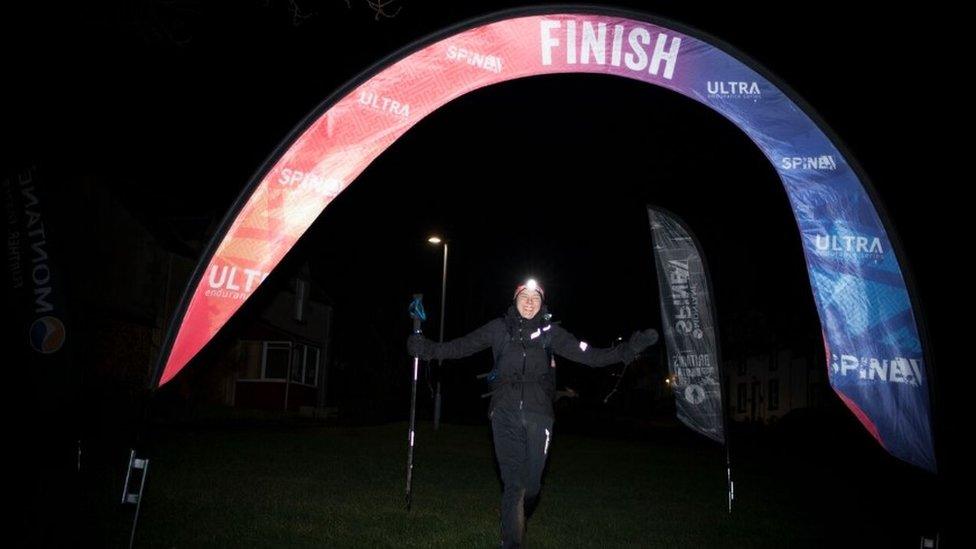 Jasmin Paris crossing the finish line