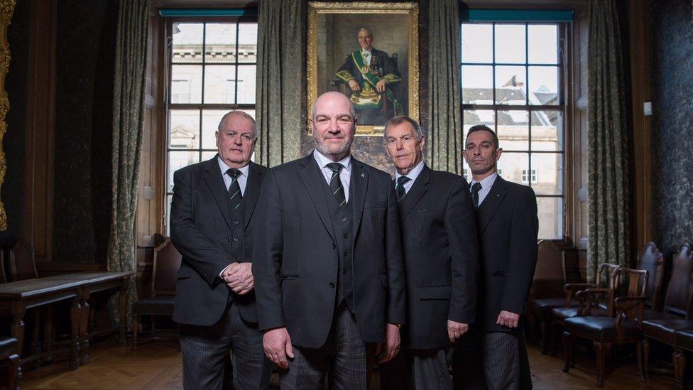 Left to right: David Begg, Grand Secretary of the Grand Lodge of Scotland, Ewan Rutherford, Depute Grand Master, Ramsay McGhee, Depute Grand Master at time of filming, Clark Wilson, Grand Tyler