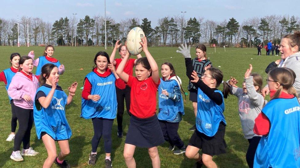 Children playing rugby on a field at Bath rugby foundation