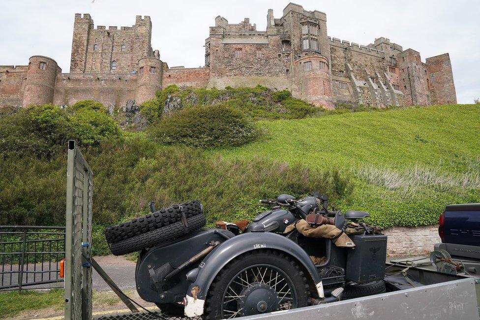 A replica SS motor bike arrives at Bamburgh Castle