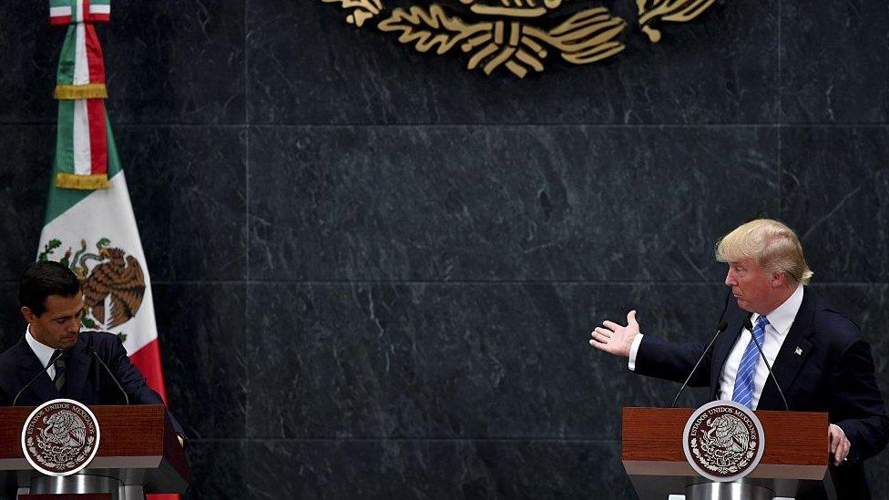 US presidential candidate Donald Trump (R) delivers a joint press conference with Mexican President Enrique Pena Nieto in Mexico City on August 31, 2016.