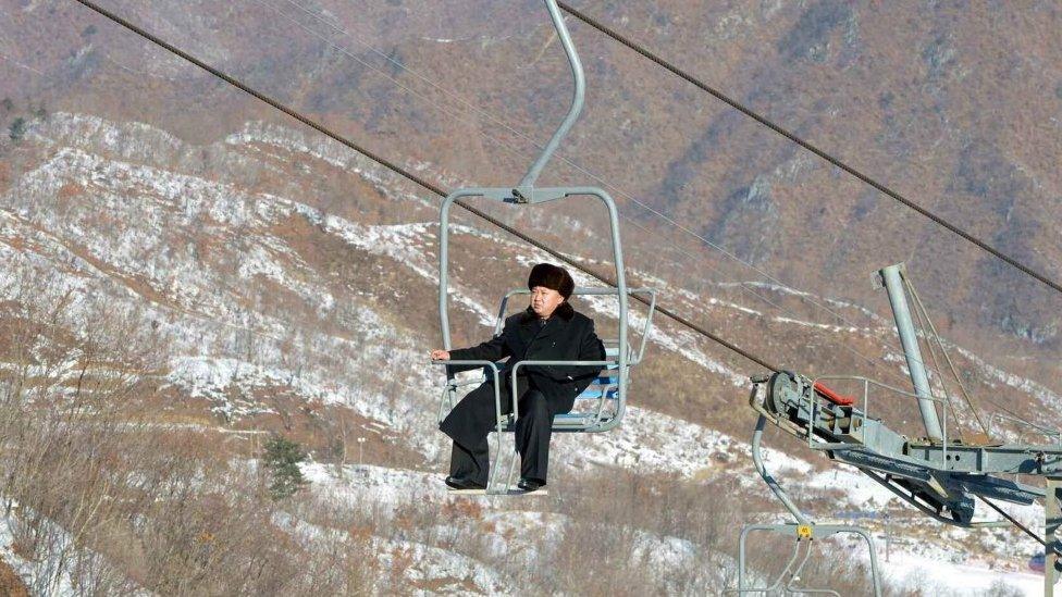 Kim Jong-un rides a ski lift at Masik ski resort in 2013 while smoking a cigarette