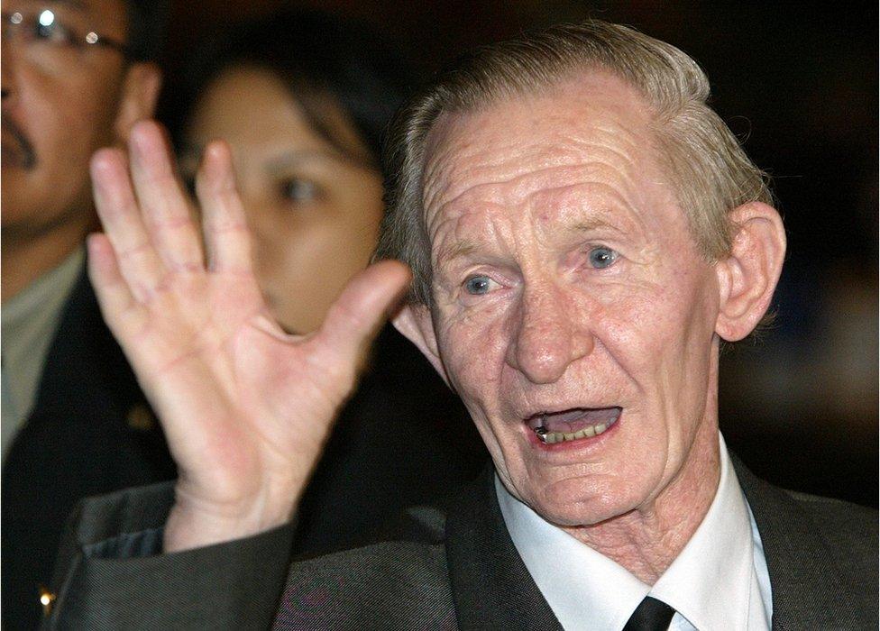 Former US soldier Charles Robert Jenkins waves upon arriving at a Jakarta hotel from North Korea in this 9 July 2004 file photo.